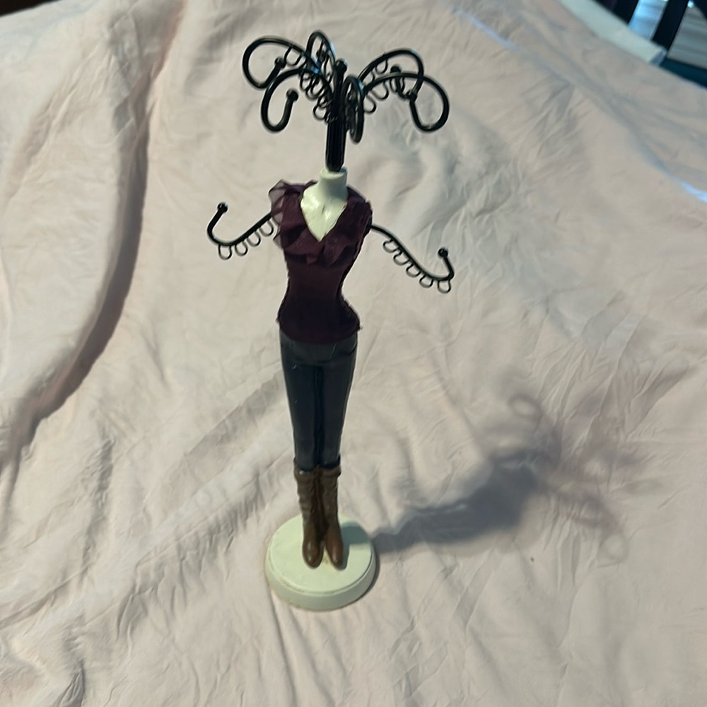 Jewelry holder- purple ruffle top, jeans, and boots.